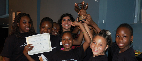 Children together with a trophy